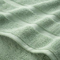 close up on border detail of jade green towels