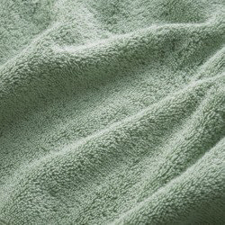 close up on texture and colour of jade green towels