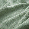 close up on texture and colour of jade green towels