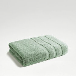 image of jade green towel folded up on light grey background