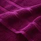close up on border detail of plum cotton towel