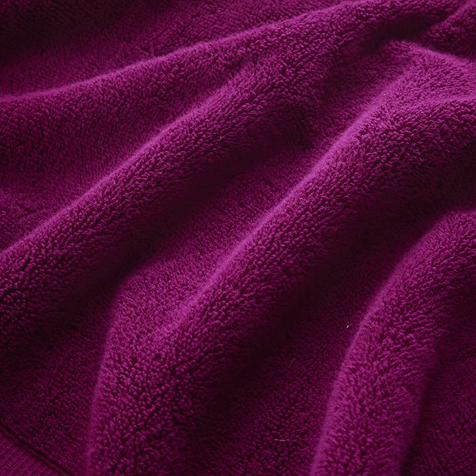close up on texture and colour of plum cotton towel