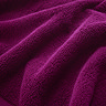 close up on texture and colour of plum cotton towel
