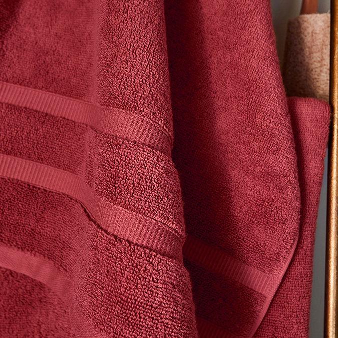 close up on border detailing of rouge cotton towel