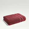 light red towel folded up on light grey background