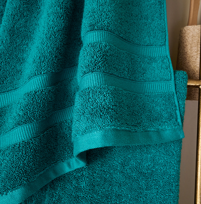 close up on border detail of teal towel