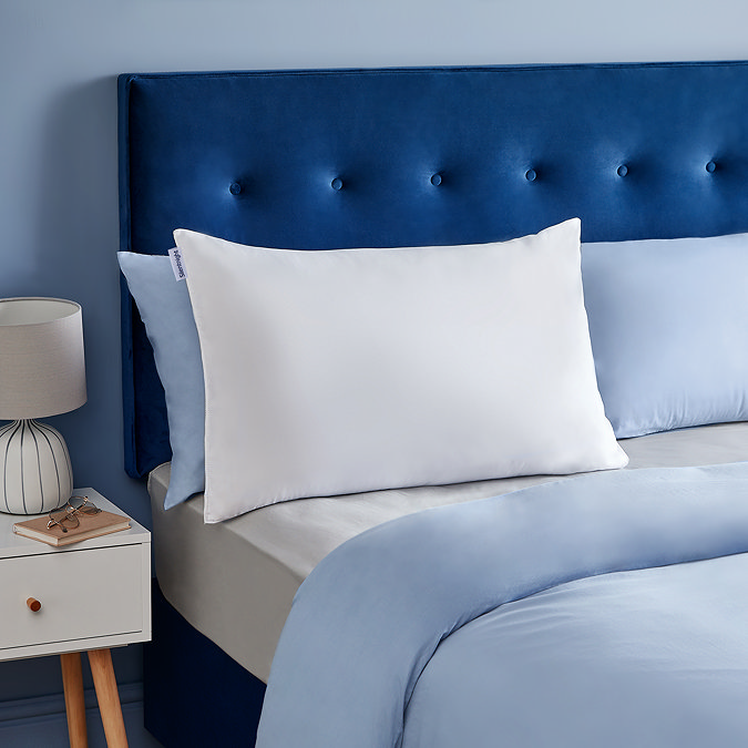 Snore pillow on bed image 1