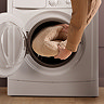 image of foot warmer being put into washing machine