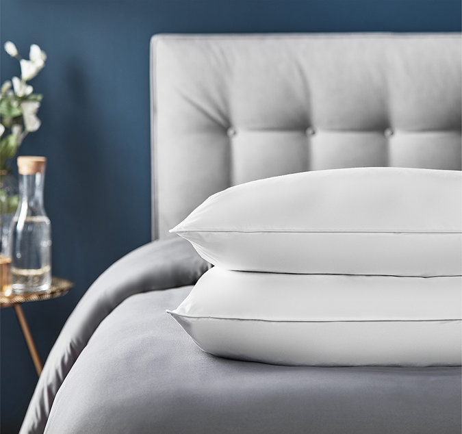 Feather and down bundle on bed image 2