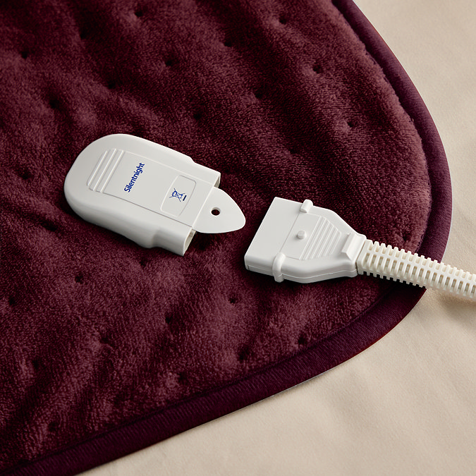 close up on plug feature of the heated throw