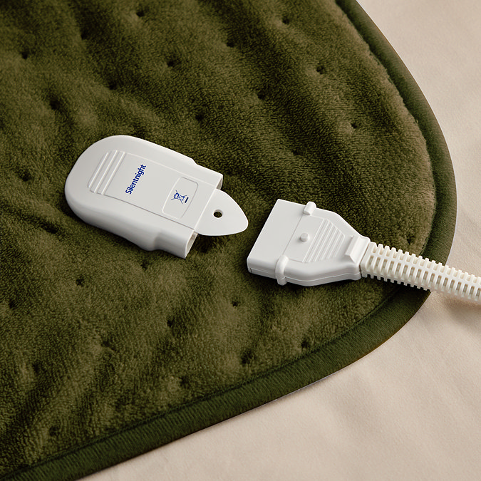 close up image of plug application of olive green heated throw