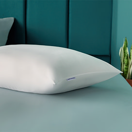 Orthopaedic pillow on bed image 1