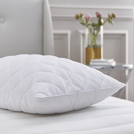 Quilted Duck Feather and Down pillow on bed image 1