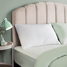 Sink in pillow on bed image 1