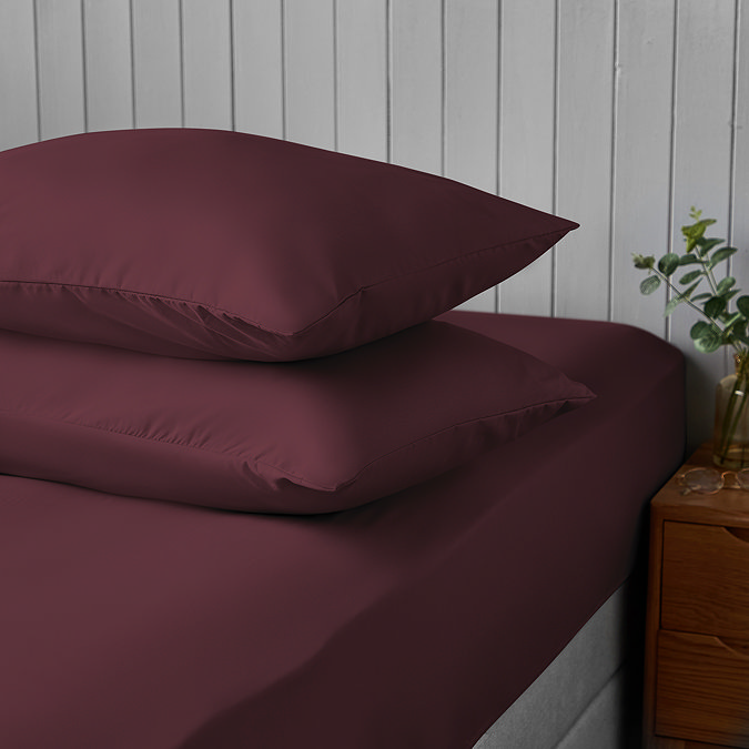 Supersoft Pillowcases in berry on bed image 2