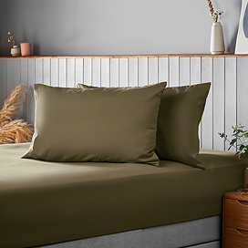 Supersoft pillowcase pair in Olive on bed image 1