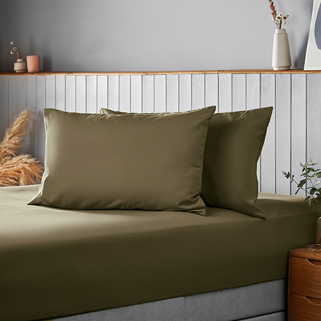 Supersoft pillowcase pair in Olive on bed image 1