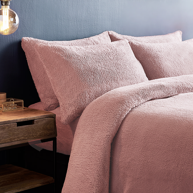 Teddy Fleece in Blush on bed image 1