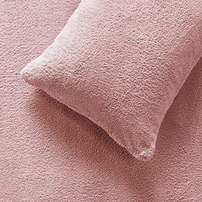Teddy Fleece in Blush pillow  on bed image 2