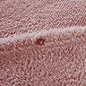 Teddy Fleece in Blush close up button fastening on bed image 3