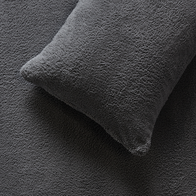 Teddy Fleece Charcoal pillow on bed image 3