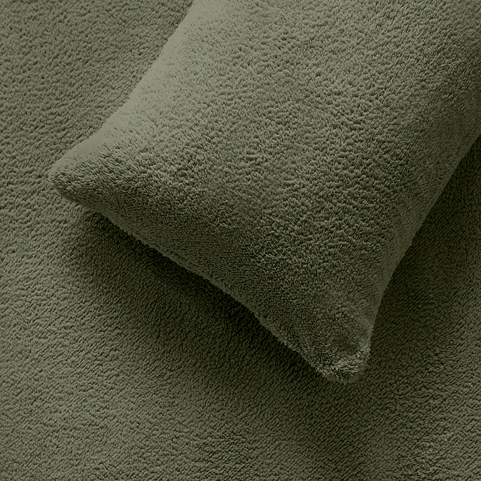 Teddy fleece in sage pillow on bed image 3