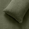 Teddy fleece in sage pillow on bed image 3