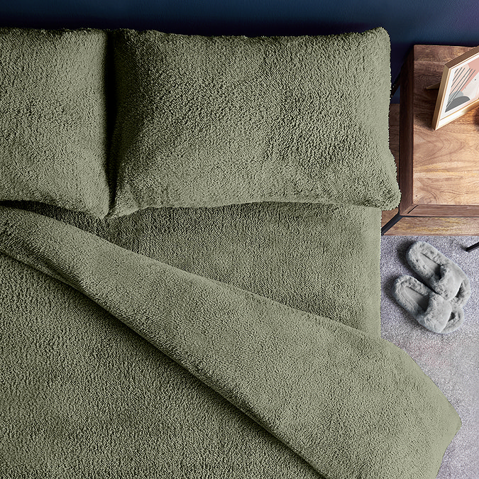 Teddy fleece in sage close up on bed image 4