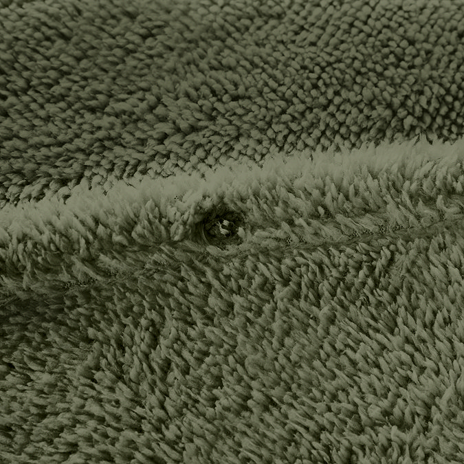 Teddy fleece in sage close up button fastening on bed image 5