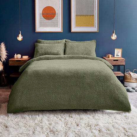Teddy fleece in sage on bed image 1