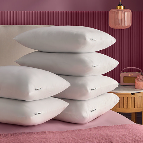 Ultrabounce 6 pack pillows on bed image 1