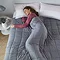 Weighted blanket on bed image 4
