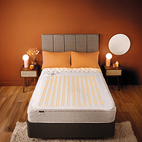 image of bed with electric blanket on top of mattress