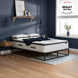 image of deep double mattress on black bed frame