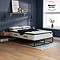 image of deep double mattress on black bed frame