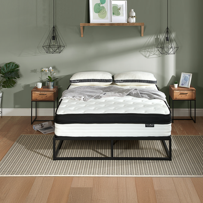 front on image of double mattress extra deep on black frame against wall