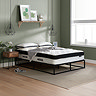 side on image of double mattress on black metal frame against light green wall
