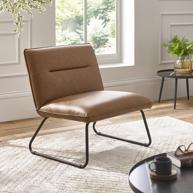 image of square brown faux leather lounge chair with black metal legs, on beige rug of modern living room