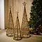 trio of wicker christmas trees, stood on rug in living room