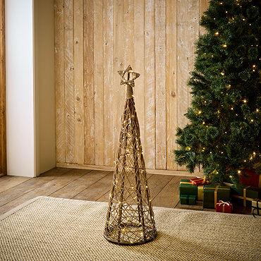small brown wicker christmas tree with star on top, image cut out on white background