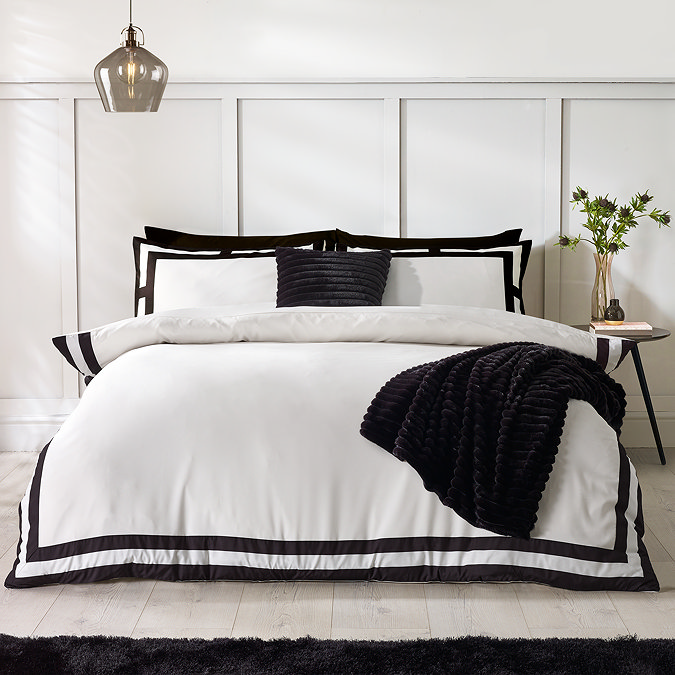 so soft mono panel duvet cover set in black on bed image 2