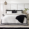 so soft mono panel duvet cover set in black on bed image 2