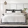 so soft mono panel duvet cover set in black on bed image