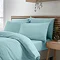 side-on image of duck egg blue duvet cover set with matching fitted sheet and pillowcases