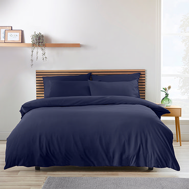 close up on so soft duvet cover in navy blue with matching fitted sheet and pillowcases