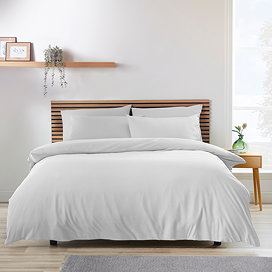soft white duvet on a nordic-inspired bed