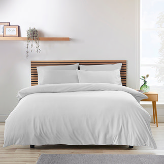 soft white duvet on a nordic-inspired bed