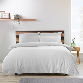 soft white duvet on a nordic-inspired bed
