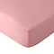 close up on corner of mattress with coral pink fitted sheet, image cut out on white background