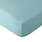 close up image on corner of mattress covered by duck egg blue fitted sheet